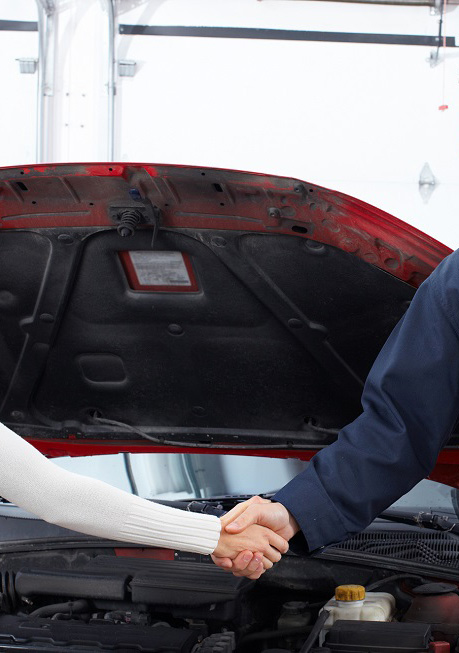 Image Of Mechanic Shaking Hands With Customer